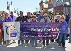 Though the rest of the annual event had to be moved indoors because of cold and windy weather, the starting off of the five kilometer walk was still led by many of the attending cancer survivors.