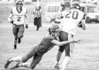 Bryer Kinsley attempts a tackle. Photo by Barb Hockenbary Photography