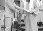 Graduation for 8th and 12th grades took place Sunday, May 16 at the Harold Thune Auditorium. Cash Herman receives his diploma from Andy Rankin, school board president. Photos by Mishayla Buchannan