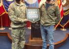 Aaden Kroells, right, stand with his recruiter, Master Sgt. Nathan Juelfs, as he joins the South Dakota Army National Guard at the Military Entrance Processing Station in Sioux Falls, S.D., Sept. 28, 2020 Courtesy photo U.S. Army National Guard