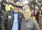 The annual Kyle Petty Charity Ride Across America fundraiser for the children’s Victory Junction camp stopped in Wall this year. Wall Mayor Marty Huether, right, presented a $1,000 community check to the cause. Shown is Richard Petty acknowledging the donation.