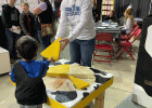 TyAnn Mortenson … assisting with the cheese puzzle. Photo courtesy Elke King