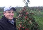 Josh Geigle toured an apple orchard. The trees can be worked from ground level. The only machine is the scoop that collects the not-quite good enough apples that are purposefully dropped to the ground to eventually become juice, sauce and other by-products.