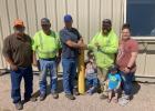 10 years with SDDOT ... Joel Larson - Supervisor of Bison, Lemmon and Faith, Jarvis Palmer - Faith Lead and John Mattheson - Area Engineer on behalf of SDDOT present Jesse King with his 10 year pin. Jesse’s wife Lorrie and children Woodrow and Wrenly were also there to celebrate. Photo courtesy Boyd Stambach