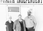 Business as usual ... during the ownership transition of The Faith Independent. New owners Russel and Krissy Johnson pictured with Faith team member Loretta Passolt. Courtesy Photo