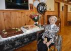 Irean Jordan ... pictured with two birthday cakes in celebration of 100 years and a crowd gathering in her honor. Photo courtesy Jared Fosheim
