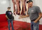Ed Hickey, head butcher, left, and Randy Gruenwald, owner, conduct a tour of a Dakota Butcher facility on Aug. 15, 2023, in Clark. Courtesy Josh Haiar / South Dakota Searchlight