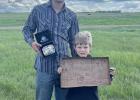 Kaden Green won the Bull riding at the Lemmon High School practice rodeo Monday, May 27th. Pictured above, with Kaden, is his brother Levi, his biggest supporter.