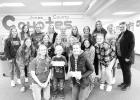 The Jones County volleyball team pictured with the recipients of the Power of Pink/Dig Pink funds for those going through cancer treatment. Back row, l-r; Emma Hunt, Jolie Dugan, Jadyn Jensen, Kendal Kinsley, Peyton Rankin, Taya Iversen, Addison Kierl, Mallory Valburg, Madison Dettler, and Head Coach Shelly Schweigert. Middle row, l-r; Timber Vevig, Sage Waldron, Kamri Kittelson, Sunny Valburg, Denae Mann, Jacey Jensen. Front row, l-r; Kristen with son Bowden Aske (recipient) and Cristen Roghair (recipient). Photo by Lea Glaze