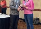Mrs. Kasey Hale ... receiving a plaque in recognition of her work. Courtesy photo