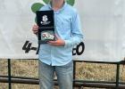 Remi Hauser with her Jr Jr Barrel Racing Buckle.