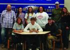 Surrounded by family, Rylan McDonnell, son of Mandi McDonnell and the late Travis McDonnell, signed his letter of intent to participate in track and field at South Dakota State University. Courtesy Photo