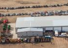 Rows of farm machinery and vehicles surrounded the Dowling shop. Cars lined the dirt roads from the shop leading all the way to Draper.