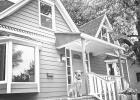 In late September, Nathaniel and Jeanette Putney purchased this home in Madison, South Dakota for roughly $145,000 in cash. The couple’s dog, Poet, sits on the front porch. Photo Courtesy of Nathanial Putney
