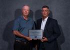 Doug Hauk and Matt Reedy accept the Community Service Award on behalf of the Trenchard Scholarship founders and Board of Trustees. Courtesy Photo