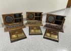 Region and State Plaques on display at the Bison School that this team has received.