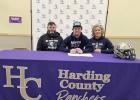 Chris, Rylee and Jennifer Veal, Rylee Veal signs to play football at Dickinson State University.