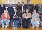 Four of the five branches of the U.S. military were represented at the New Underwood Veteran's Day celebration. Back row from left are Buzz Johnson, Army, Don Krog, Air Force, Ron Racicky, Navy, Wes Reeves, Army National Guard, Melvin Fernau, Army, Gene Crosbie, Army National Guard, Ken Karp, Army, Chuck Dockter, Army, Bill Winegar, Army, Don Weibers, Army, Dennis Anderson, Navy, Casey Tippmann, Army, Ronald Miller, Army and Larry Broomfield, Air Force. Front row from left are Matthew Emmons, Air Force, Dav