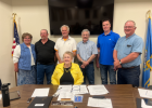 The Wall City Council stands behind the newest Mayor of the city, Mary Williams. During their last meeting Williams was sworn in as Mayor, along with Stan Anderson who was reelected to another term on the council. Pictured is Mary Williams (seated) and the city council (standing left to right) Kelly Welsh, Jerry Morgan, Stan Anderson, Rick Hustead, Mike Anderson and Dan Hauk. Courtesy photo