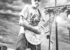 Local musician Anthony Michalek plays lead guitar with Kenny Feidler & The Cowboy Killers at the concert series during the weekend of the Meghan Newsam Community Celebration. Photo by Barb Hockenbary Photography