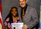 Melody Olugbenga ... of Faith High School receiving her award for Academic Excellence from Governor Larry Rhoden in Pierre at the recognition luncheon. Courtesy photo