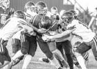 Cooper Feddersen attempts to push through a five on one tackle. Jones County played against Timber Lake on Friday, September 15. Photo by Barb Hockenbary Photography