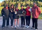 Assistant Coach Alan Grinsteinner, Ella Anderson, Allison Kahler, Greta Anderson, Mary Carmichael and Coach Jeffrey Johnson with the first place trophy.