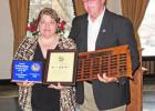 Jo Manke-Rodgers receives Postmaster of the Year Award presented by Steve Lenoir, theVice President of South Dakota's National League of Postmasters.