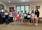 Photo L to R: Ella Brown, LoElle Grueb, Kaydence Williams, Kylie Williams, Bentley Fallon, Madelyn Garrigan, Gracie Garrigan, Maci Harper, and Delaney Campbell. Photo courtesy Alison Grueb