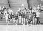 Fans, coaches, and players celebrate a Coyote win on Thursday, September 30, when the Jones County volleyball team triumphed over the Kadoka Kougars in 3-1 matches. Way to go, ladies! Photo by Barb Hockenbary Photography