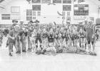 The volleyball team with their biggest fans who donned roedo clown attire and makeup to the last game of the Region 7B tournament against Wall. Photo by Barb Hockenbary